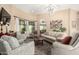 Bright living room with dark wood floors, neutral paint, and a modern light fixture at 5978 E Chuckwalla Trl, Cave Creek, AZ 85331
