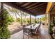 Covered patio with large dining table and views of the desert landscape at 5978 E Chuckwalla Trl, Cave Creek, AZ 85331