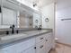 Bathroom features a double sink vanity, a large mirror, and a shower at 6130 N 12Th Way, Phoenix, AZ 85014