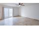 Bright bedroom with a ceiling fan and a sliding glass door, ideal for relaxing at 6130 N 12Th Way, Phoenix, AZ 85014