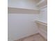 Walk-in closet equipped with shelving for storage, creating organized space at 6130 N 12Th Way, Phoenix, AZ 85014