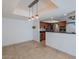 Open floor plan showcases dining area open to modern kitchen with pendant lighting at 6130 N 12Th Way, Phoenix, AZ 85014