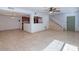 View of open concept living room featuring tile floors and staircase at 6130 N 12Th Way, Phoenix, AZ 85014