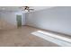 Well-lit living room with tile flooring, stairs and view of front door at 6130 N 12Th Way, Phoenix, AZ 85014