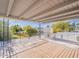 The wooden patio deck offers backyard views with a wrought iron railing at 6130 N 12Th Way, Phoenix, AZ 85014