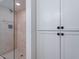 Modern shower with glass door, stone tile, and brushed nickel fixtures, providing an elegant spa-like experience at 6130 N 12Th Way, Phoenix, AZ 85014
