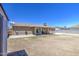 Expansive backyard featuring a covered patio and block fencing for privacy at 6939 W Cambridge Ave, Phoenix, AZ 85035
