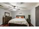 The bedroom includes a dark wood bedroom set and flooring, with a light-colored ceiling fan at 6939 W Cambridge Ave, Phoenix, AZ 85035