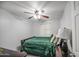 Bedroom featuring tile floors, ceiling fan, and window at 6939 W Cambridge Ave, Phoenix, AZ 85035