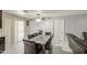 A dining area featuring tile flooring and a sliding glass door for natural light and outdoor access at 6939 W Cambridge Ave, Phoenix, AZ 85035