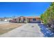 Inviting single-story home featuring a well-maintained yard and long driveway and desert landscaping at 6939 W Cambridge Ave, Phoenix, AZ 85035