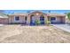 Charming single-story home with a blank canvas front yard ready for personalization and landscape at 6939 W Cambridge Ave, Phoenix, AZ 85035