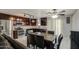 Bright eat-in kitchen features stainless steel appliances, granite counters and a ceiling fan at 6939 W Cambridge Ave, Phoenix, AZ 85035