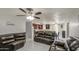 The living room is connected to the kitchen and dining areas in an open floor plan at 6939 W Cambridge Ave, Phoenix, AZ 85035