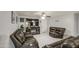 The living room features cozy sofas and a traditional TV console with an electric fireplace at 6939 W Cambridge Ave, Phoenix, AZ 85035