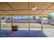 Covered patio showcasing backyard with block wall, shed, and ample space at 6939 W Cambridge Ave, Phoenix, AZ 85035