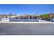 Street view of a cozy home featuring a well-manicured hedge and long driveway at 6939 W Cambridge Ave, Phoenix, AZ 85035