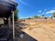 Picture of the backyard featuring its rock and dirt-filled ground at 7214 S 42Nd St, Phoenix, AZ 85042