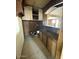 Bathroom with a sink, cabinets, shelving, and tile flooring at 7214 S 42Nd St, Phoenix, AZ 85042