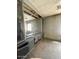 A bedroom featuring a built-in dresser/storage unit with mirror and dark linoleum floors at 7214 S 42Nd St, Phoenix, AZ 85042