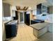 Functional kitchen with black appliances, tile floors, and breakfast bar at 7214 S 42Nd St, Phoenix, AZ 85042