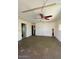 An empty living room featuring linoleum floors and natural light from exterior windows at 7214 S 42Nd St, Phoenix, AZ 85042