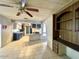 Open-concept living area with tile flooring and a kitchen view at 7214 S 42Nd St, Phoenix, AZ 85042