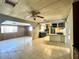Open-concept living space with tile floors and adjacent kitchen at 7214 S 42Nd St, Phoenix, AZ 85042