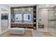 Elegant bathroom featuring double sinks, a spacious glass shower, and a walk-in closet at 7438 E San Jacinto Dr, Scottsdale, AZ 85258