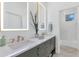 Bright bathroom features double sinks, vanity lighting, and subway tile at 7438 E San Jacinto Dr, Scottsdale, AZ 85258
