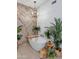 Bright bathroom with a modern soaking tub, gold chandelier, and marble accent wall at 7438 E San Jacinto Dr, Scottsdale, AZ 85258