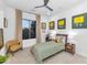 Cozy bedroom featuring neutral decor and an outdoor view at 7438 E San Jacinto Dr, Scottsdale, AZ 85258