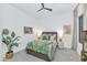 Light and airy bedroom with leafy green accents and carpeted floor at 7438 E San Jacinto Dr, Scottsdale, AZ 85258