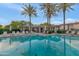 Resort-style community pool with ample lounge chairs and shaded cabanas for relaxation at 7438 E San Jacinto Dr, Scottsdale, AZ 85258