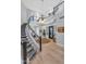 Grand foyer showcasing a curved staircase with iron railings and elegant hardwood flooring at 7438 E San Jacinto Dr, Scottsdale, AZ 85258