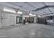 Organized garage space featuring ample storage solutions, epoxy flooring, and a clean, well-lit area at 7438 E San Jacinto Dr, Scottsdale, AZ 85258