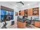 Bright home office featuring custom built-ins, modern fixtures, and an exercise bike for added convenience at 7438 E San Jacinto Dr, Scottsdale, AZ 85258