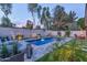 Backyard pool with stylish lounge, well-manicured landscaping, and inviting ambiance perfect for leisure and relaxation at 7438 E San Jacinto Dr, Scottsdale, AZ 85258