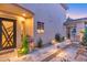 Picturesque side yard featuring a stone pathway, vibrant plants, and relaxing seating at 7438 E San Jacinto Dr, Scottsdale, AZ 85258