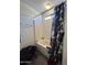 Bathroom with a tub/shower combo and vinyl flooring at 7664 W Vermont Ave, Glendale, AZ 85303