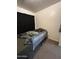 Bedroom with carpet, black out curtains and basic furnishings at 7664 W Vermont Ave, Glendale, AZ 85303