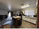 Features an island, a double sink, wood-style vinyl flooring, and lots of lighting at 7664 W Vermont Ave, Glendale, AZ 85303