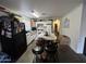 Kitchen featuring an island, ample cabinet space, and modern appliances at 7664 W Vermont Ave, Glendale, AZ 85303