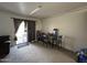 Carpeted living room, sliding glass door, and table with chairs at 7664 W Vermont Ave, Glendale, AZ 85303