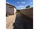 Side yard featuring a block wall, providing privacy and potential for landscaping at 7664 W Vermont Ave, Glendale, AZ 85303