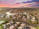 Picturesque aerial view of the community, featuring waterfront homes, a scenic lake, and mature trees at 780 S Lagoon Dr, Gilbert, AZ 85233