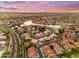 Aerial view captures the expansive community, with waterfront homes, lush greenery, and serene lakes at 780 S Lagoon Dr, Gilbert, AZ 85233