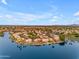 An expansive community on the water with lush landscaping and a lake view can be seen in this aerial shot at 780 S Lagoon Dr, Gilbert, AZ 85233