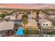 A stunning pool and beautiful backyard are captured from above, nestled in a Gathering-friendly neighborhood at 780 S Lagoon Dr, Gilbert, AZ 85233