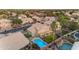 A backyard paradise with a large pool and landscaping in this Gathering-friendly neighborhood is seen in this elevated view at 780 S Lagoon Dr, Gilbert, AZ 85233